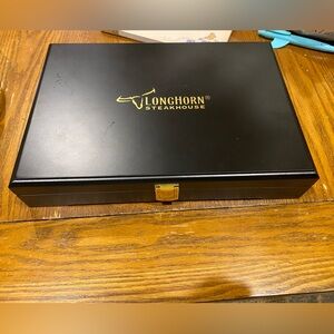 set of four LongHorn Steakhouse knives